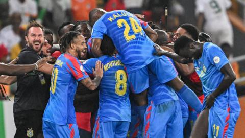 DR Congo players celebrate a goal against Guinea at the 2023 Africa Cup of Nations