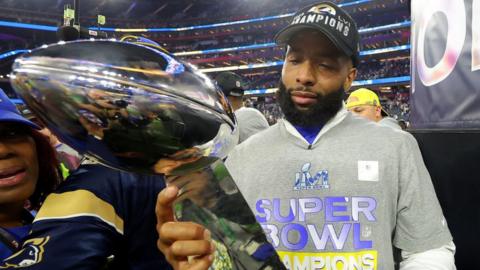 Odell Beckham Jr holds the Super Bowl trophy in 2022