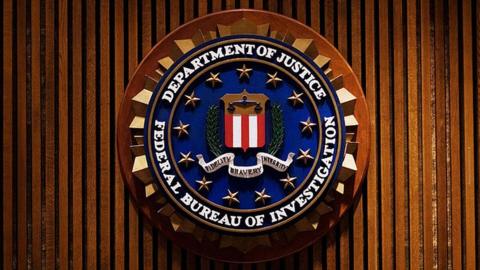 A photograph of the FBI shield