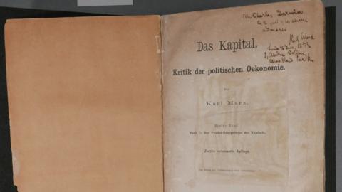 An old copy of Karl Marx's "Das Kapital". First page, with inscription written on it.