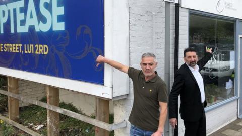 The advert next to Basile restaurant in Guildford Street, Luton