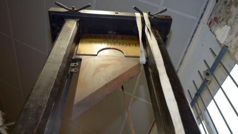 A guillotine is pictured in its auction room in Nantes, western France, on March 25, 2014.