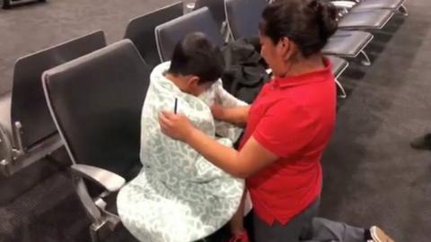 A migrant mother and her son are reunited after immigrant separation, in Baltimore, Maryland.