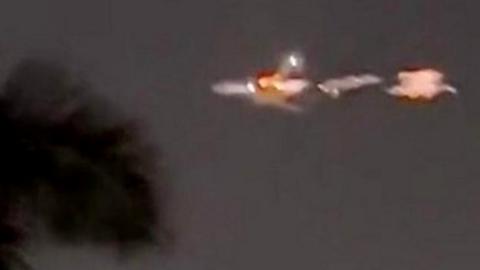 Footage of plane spluttering flames