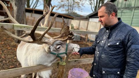 James Willliams, co-director of Maldon Promenade Petting Zoo, with one of the zoo's reindeers