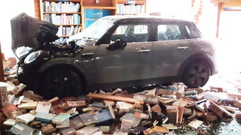 Car embedded in Sandiacre library