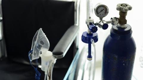 Medical Oxygen Tube And The Wheelchair Behind It