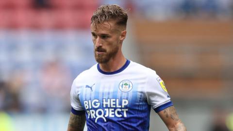 Joe Bennett on the pitch for Wigan