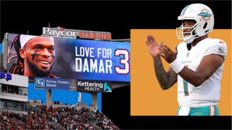 Video screen showing support for Damar Hamlin and Tua Tagovailoa clapping while playing for the Miami Dolphins