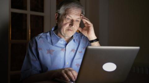 Man with gambling addiction on his laptop