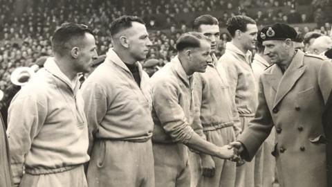 Jackie Roberts shakes hands with Field Marshal Montgomery at Burnden Park, Bolton Wanderers' home