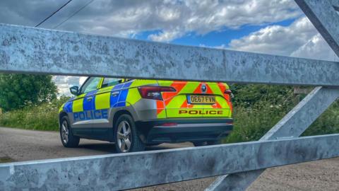 Leicestershire Rural Police car seen through a fence