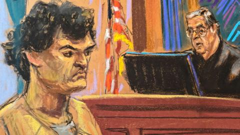FTX cryptocurrency exchange founder Sam Bankman-Fried stands before U.S. District Judge Lewis Kaplan as he is sentenced to 25 years in prison, at Federal Court in New York City, U.S., March 28, 2024 in this courtroom sketch. REUTERS/Jane Rosenberg