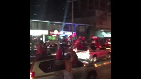 People wave flags and honk horns celebrating Panama's World Cup qualification