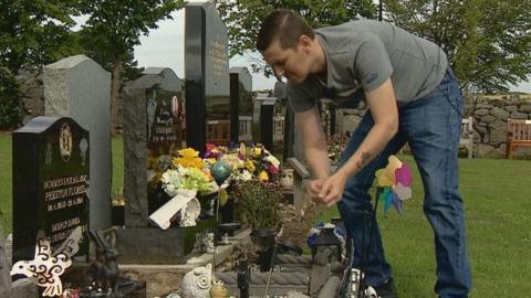 Keith Will at son's grave