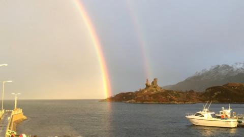 Castle Moil and rainbow before the lightning strike