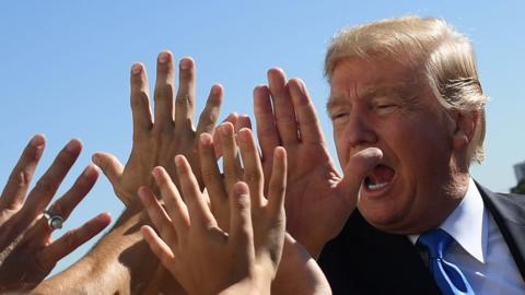 Donald Trump high-fives