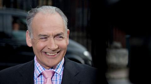 ITV television news anchor Alistair Stewart outside the offices of the News of The World newspaper on Pennington Street