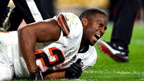 Nick Chubb on the turf in pain after suffering a knee injury