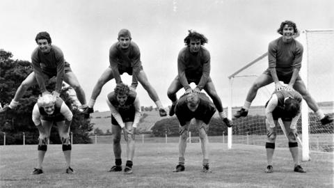Top row left to right: Burnley FC players Paul Fletcher, Mick Docherty, Eric Probert and Dave Thomas. Bottom row left to right: Peter Mellor, Martin Dobson, Jim Thompson and an un-named player in 1971