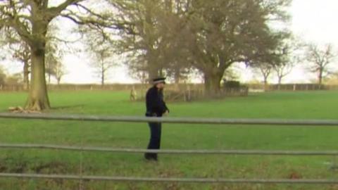 Police officer in field