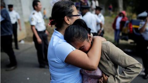 Family members react as they wait for news of their loved ones after a fire broke out at the Virgen de Asuncion home in San Jose Pinula on the outskirts of Guatemala City, March 8, 2017