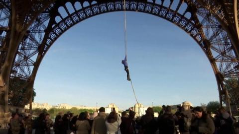 Rope climber at Eiffel Tower