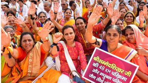 Members of the Jain community protest against the decision of the Jharkhand governmnet to turn sacred 'Shri Sammed Shikharji' into a tourist place and vandalisation of their temple in Gujarat's Palitana, at Azad Maidan, on January 4, 2023 in Mumbai, India