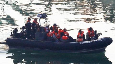 Migrants in Border Force dinghy being brought into Dover port (file image)