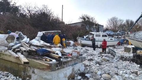 The clean-up operation at the marina in Holyhead