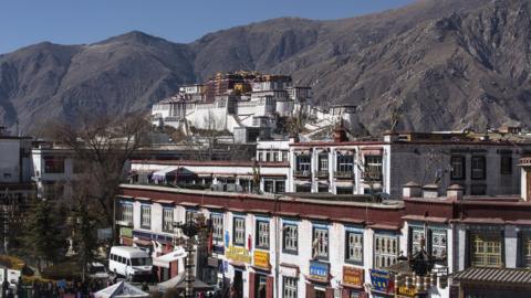 Wide shot of the landscape, temple and buildings in Lhasa, Tibet