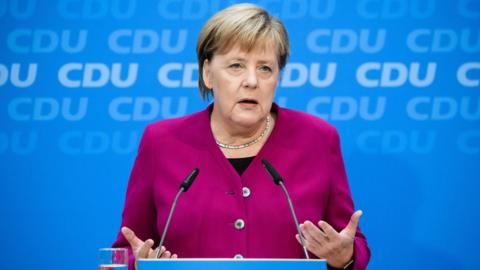 Angela Merkel addresses a press conference on monday