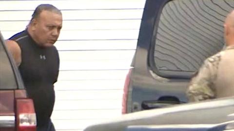 FBI officers escort Cesar Sayoc into an vehicle at FBI headquarters in Miramar, Florida, 26 October 2018