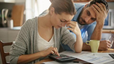 Couple in debt (posed)