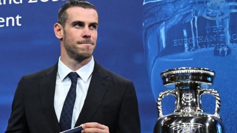 Gareth Bale alongside the European Championship trophy at the ceremony in Switzerland