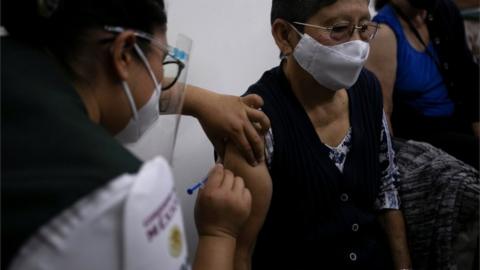 Health personnel vaccinates older adults, in Morelia, Michoacan, Mexico, 26 March 2021