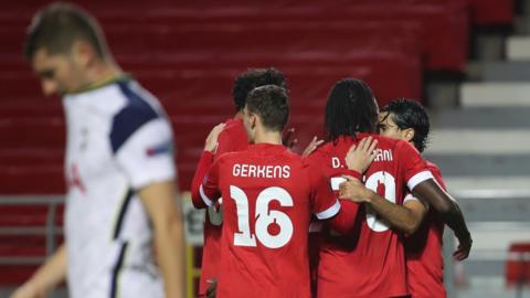 Royal Antwerp's players celebrate scoring against Tottenham in the Europa League