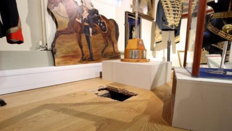 Hole in museum floor