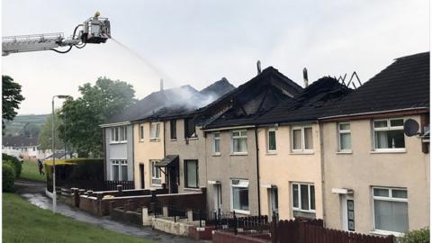 Fire service putting out fire at homes in County Antrim