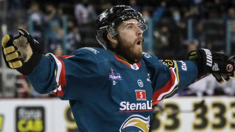 Lewis Hook celebrates after scoring one of his two goals in Belfast's win on Sunday