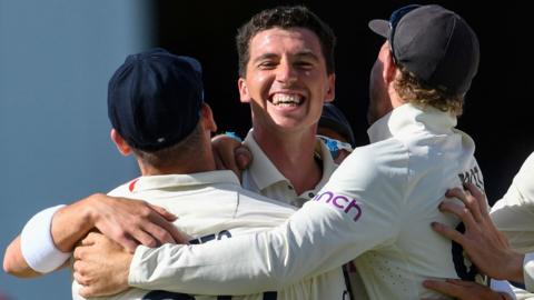 England bowler Matthew Fisher celebrates taking a wicket