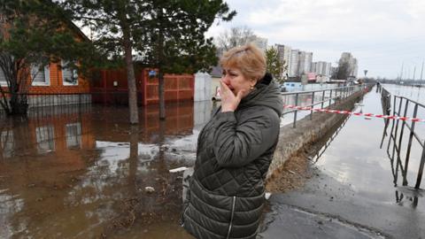 Woman in flooded area of Orenburg city