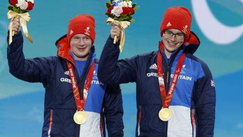 Andrew and Neil Simpson pose with their gold medals