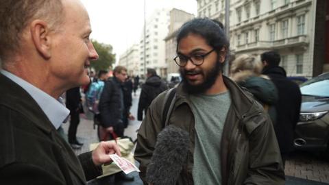 BBC reporter Simon Gompertz talking to an interviewee