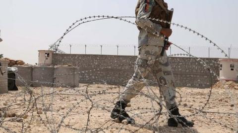 Afghan security officials patrol on the outskirts of Jalalabad, Afghanistan