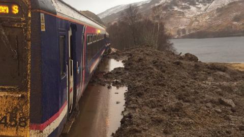 Train trapped in landslide