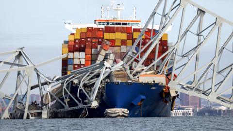A view of the Dali cargo vessel wedged into the metal of the collapsed Francis Scott Key Bridge