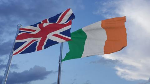 A union flag and an Irish flag