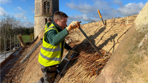 The thatching team at work on St Mary's