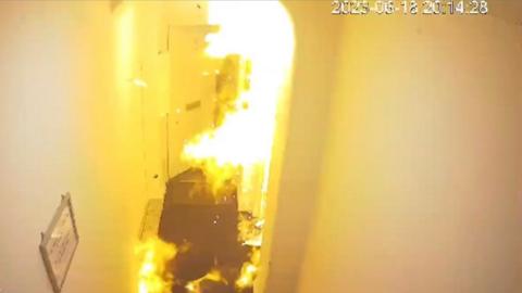 A fire in a corridor outside a flat